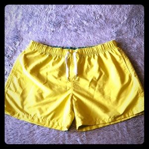 Yellow swim trunks.